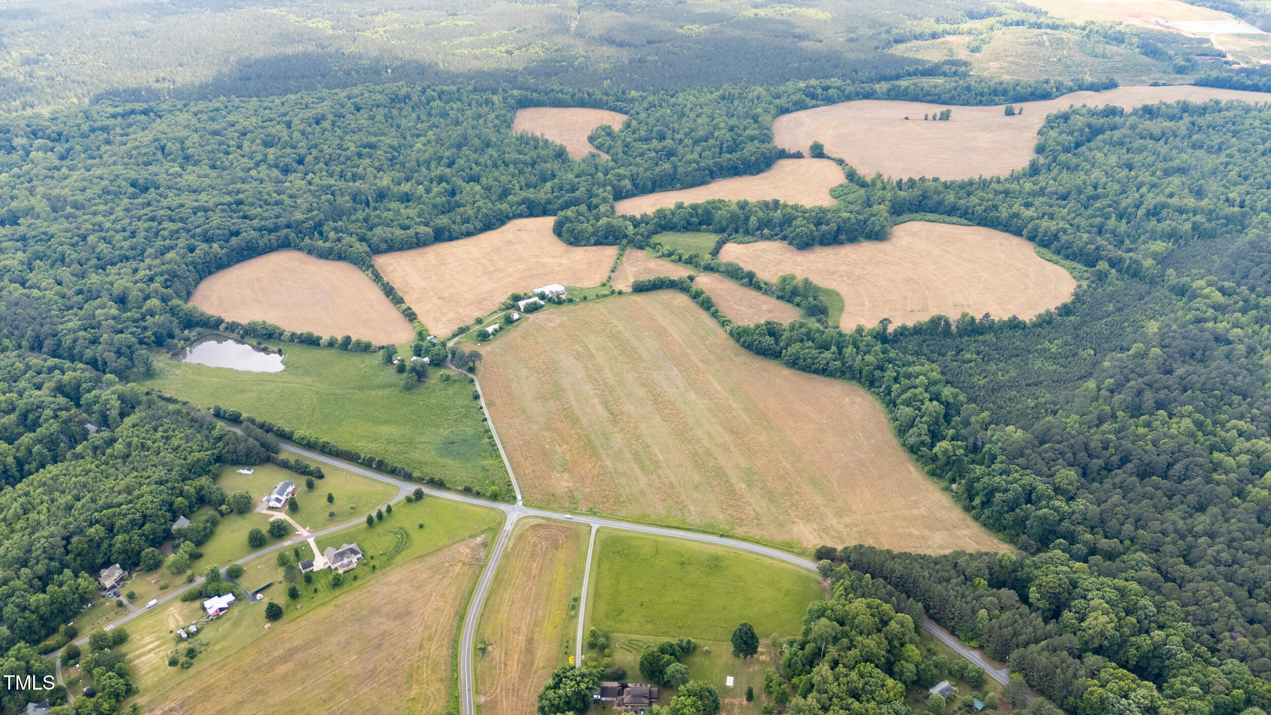 7941 Morrow Mill Road Graham, NC 27253 - Photo 2 of 17 an aerial view of a house with outdoor space and trees all around