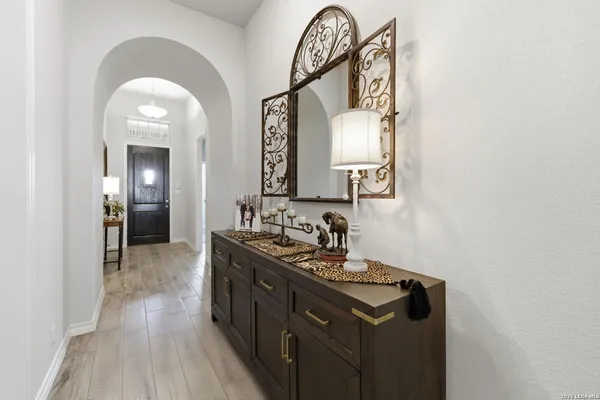 a kitchen with a sink and a mirror