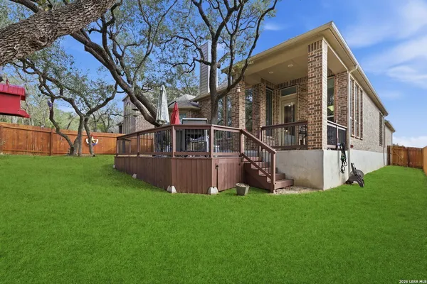 a view of house with backyard