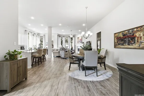 a view of a dining room with furniture and wooden floor