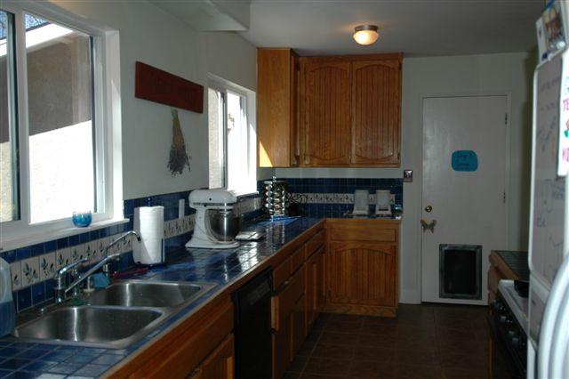 1402 Daly Road Ojai, CA 93023 - Photo 2 of 7 a kitchen with stainless steel appliances granite countertop a sink and a refrigerator