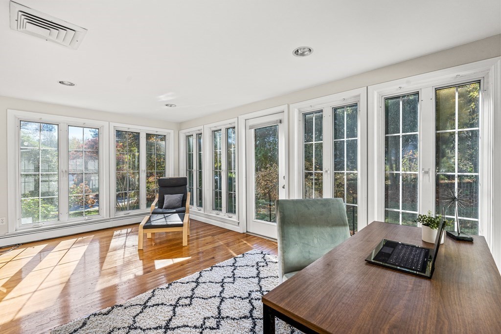 25 Lockeland Road Winchester, MA 01890 - Photo 17 of 40 a living room with furniture and floor to ceiling windows