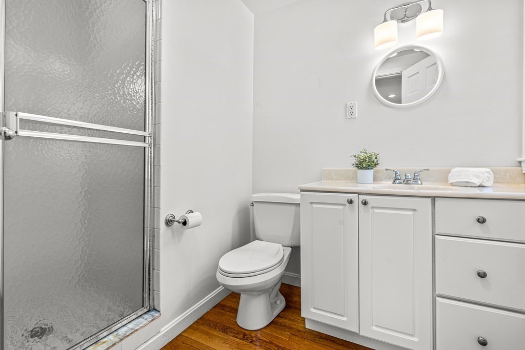 25 Lockeland Road Winchester, MA 01890 - Photo 22 of 40 a bathroom with a toilet a sink and mirror