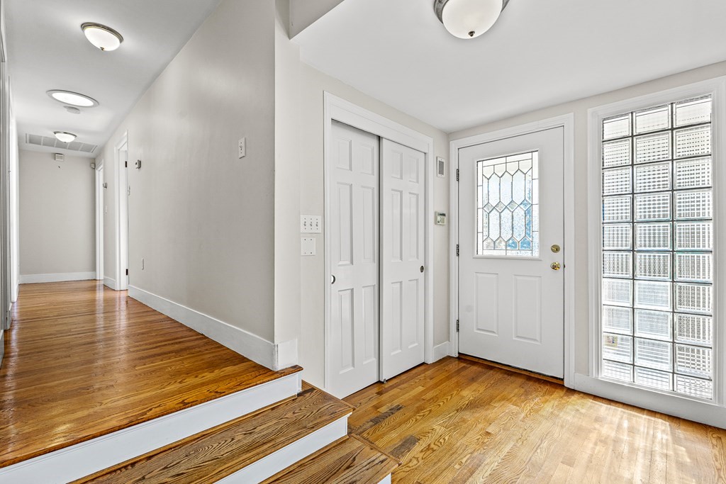 25 Lockeland Road Winchester, MA 01890 - Photo 3 of 40 a view of an empty room with window and wooden floor