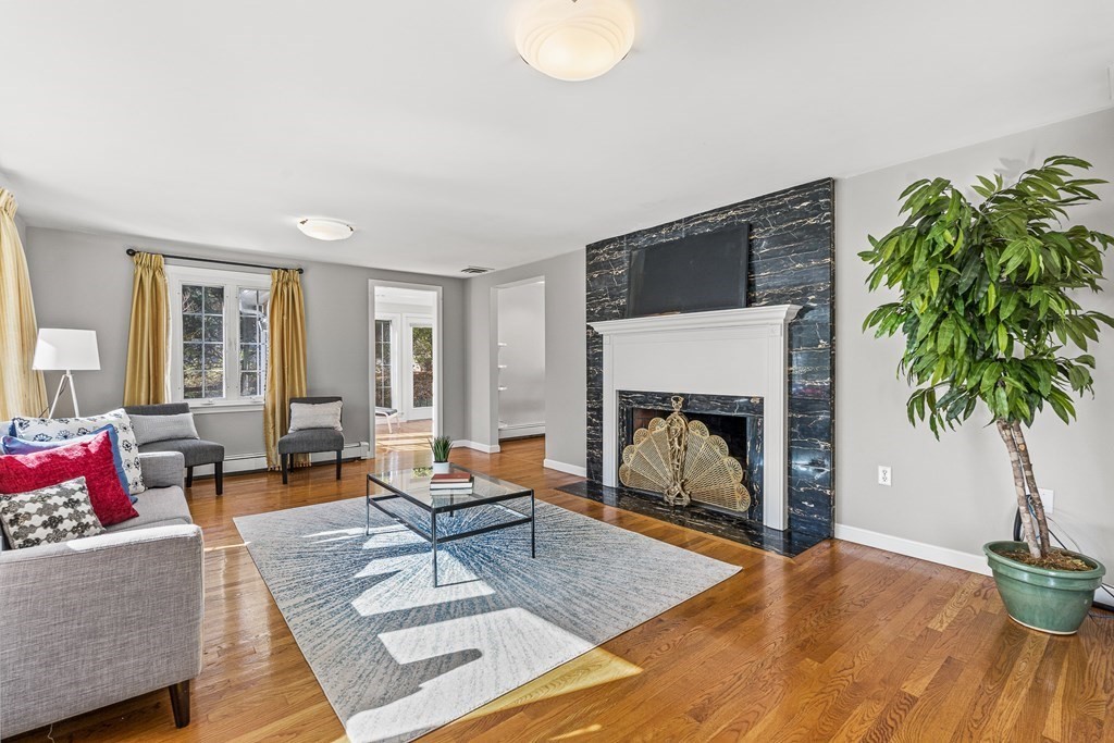 25 Lockeland Road Winchester, MA 01890 - Photo 5 of 40 a living room with furniture and a fireplace