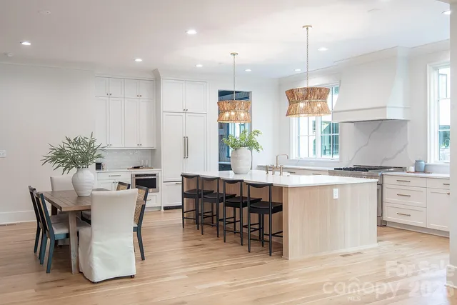 a stove top oven sitting inside of a kitchen