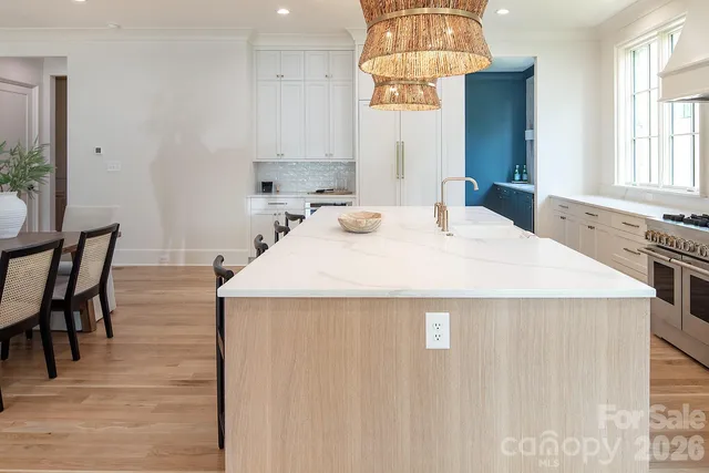 a kitchen with sink stove and cabinets