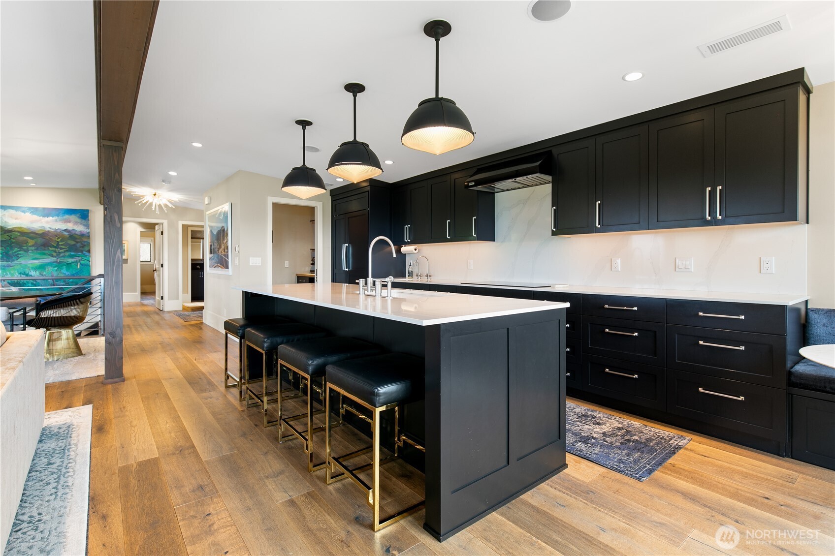 2816 South Hudson Street Seattle, WA 98108 - Photo 15 of 40 a kitchen with stainless steel appliances kitchen island granite countertop a stove a sink and a microwave