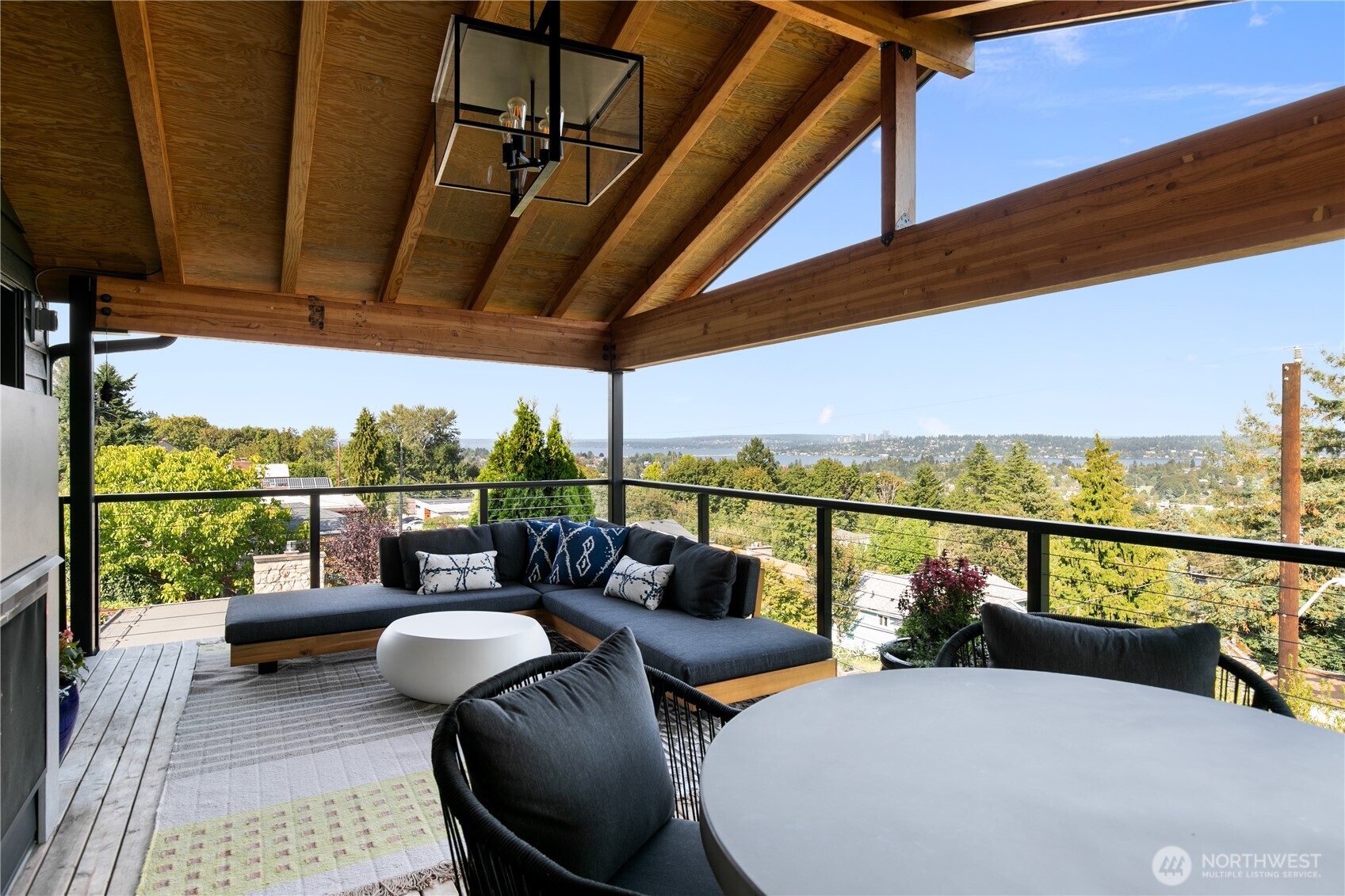 2816 South Hudson Street Seattle, WA 98108 - Photo 19 of 40 a balcony with furniture and a floor to ceiling window