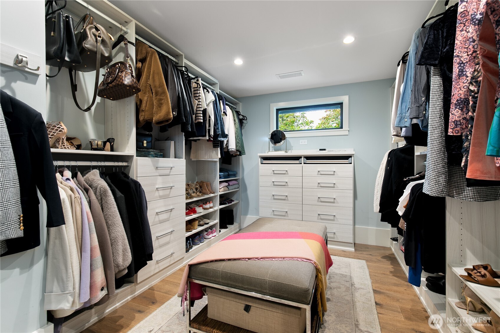 2816 South Hudson Street Seattle, WA 98108 - Photo 28 of 40 a view of walk in closet with clothes and shoes