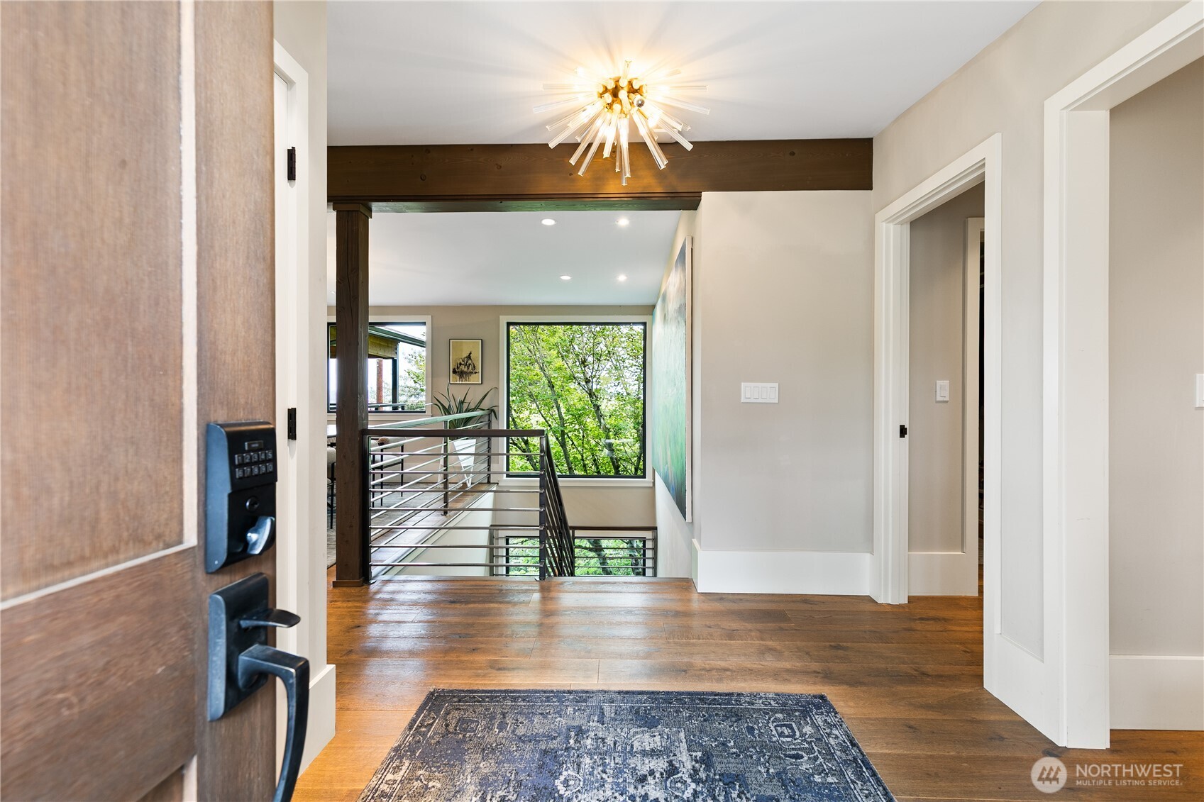 2816 South Hudson Street Seattle, WA 98108 - Photo 4 of 40 a view of a hallway to a livingroom with furniture wooden floor and window