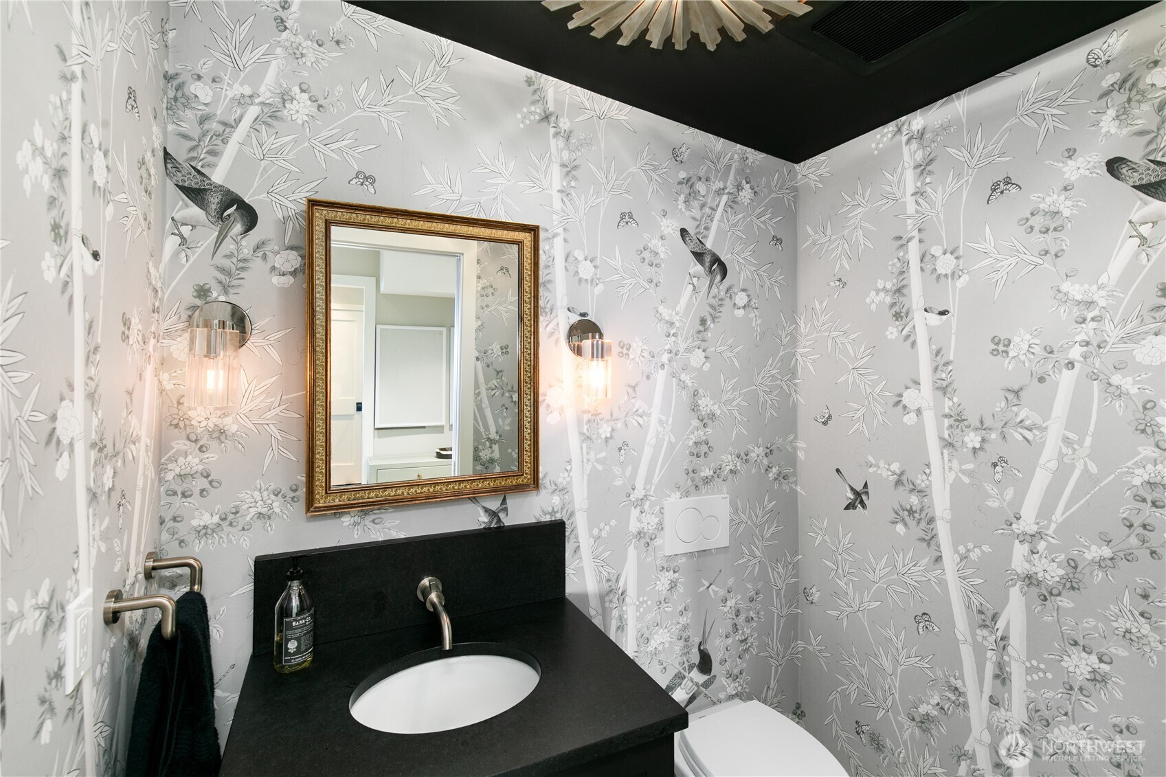 2816 South Hudson Street Seattle, WA 98108 - Photo 6 of 40 a bathroom with a toilet sink and mirror
