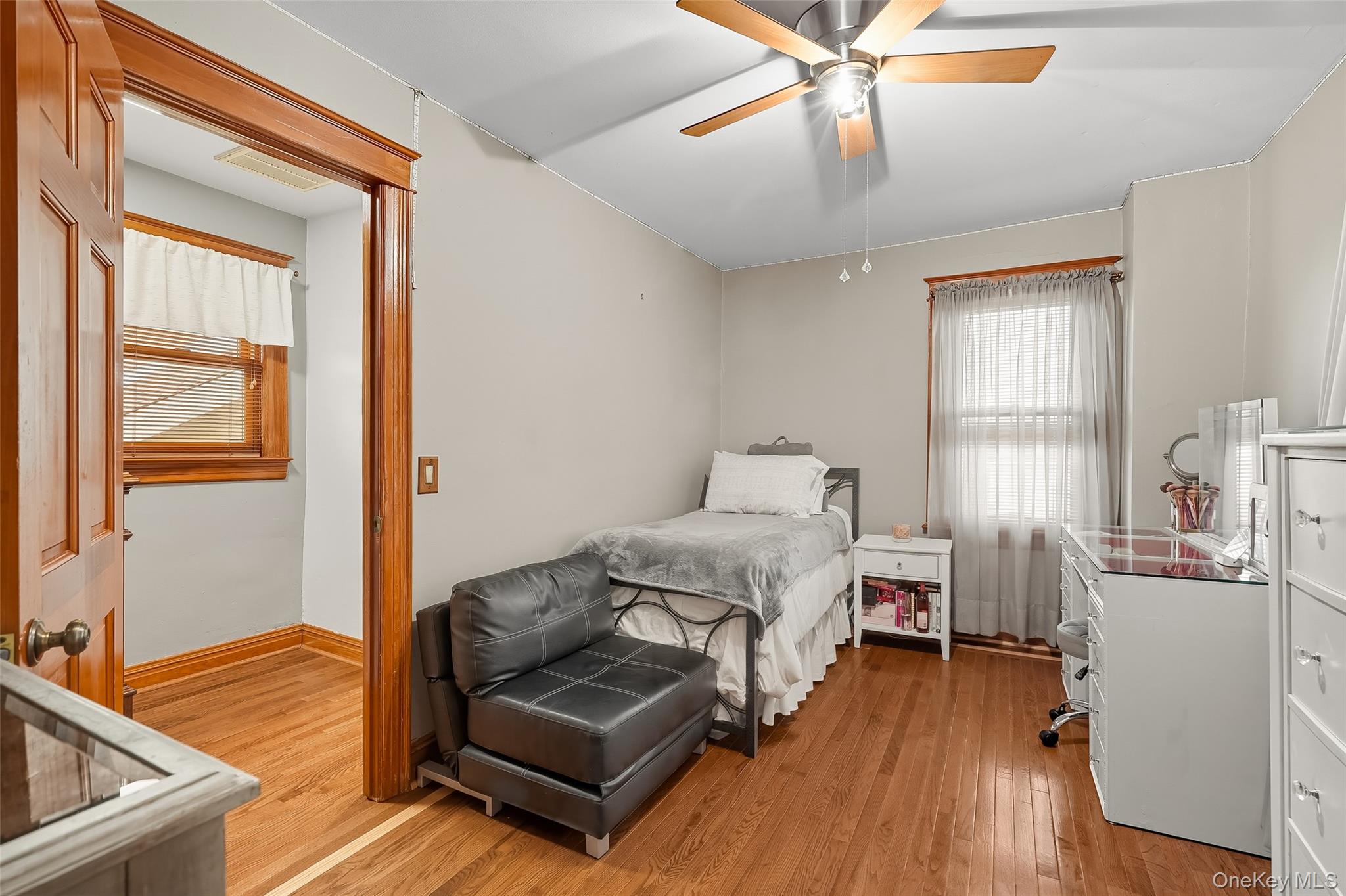1444 Gillespie Avenue Bronx, NY 10461 - Photo 16 of 49 a bedroom with furniture and a wooden floor