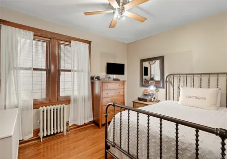 a bedroom with furniture and a window