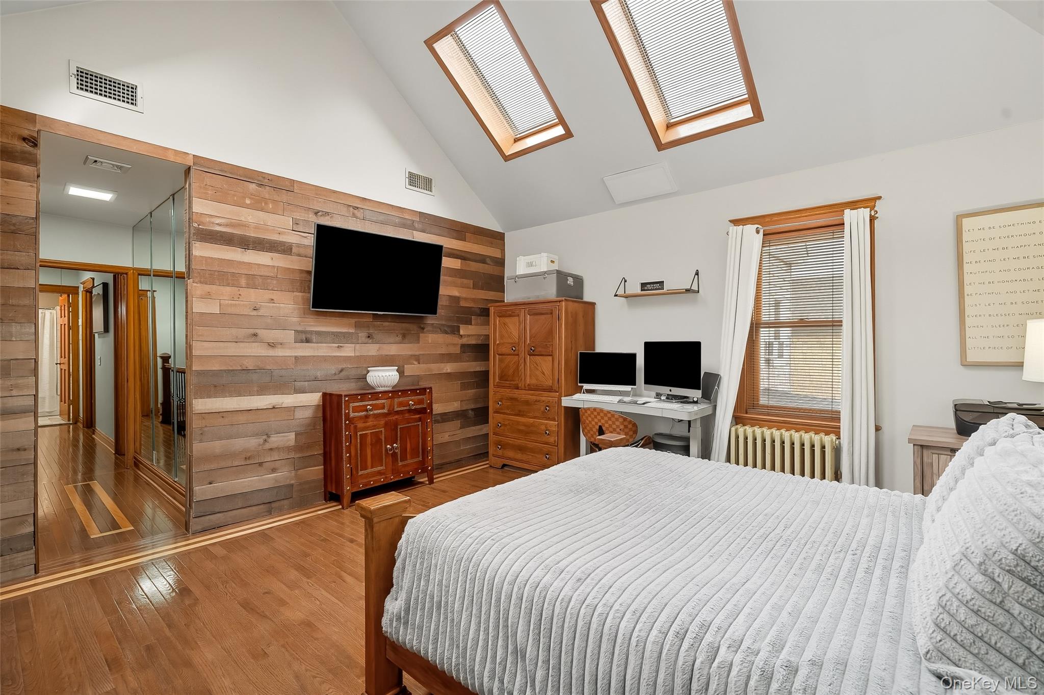 1444 Gillespie Avenue Bronx, NY 10461 - Photo 24 of 49 a bedroom with a bed and a flat screen tv