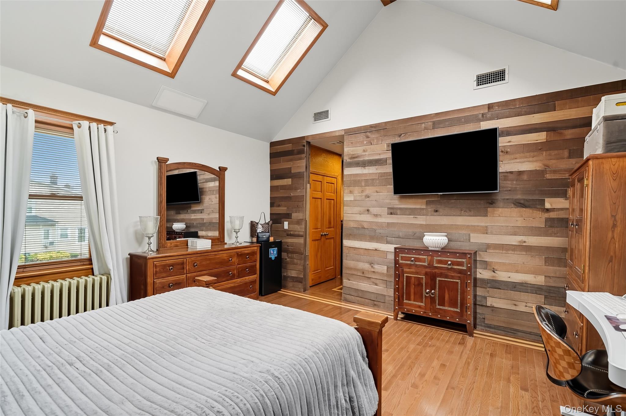 1444 Gillespie Avenue Bronx, NY 10461 - Photo 25 of 49 a bedroom with a bed and a flat screen tv