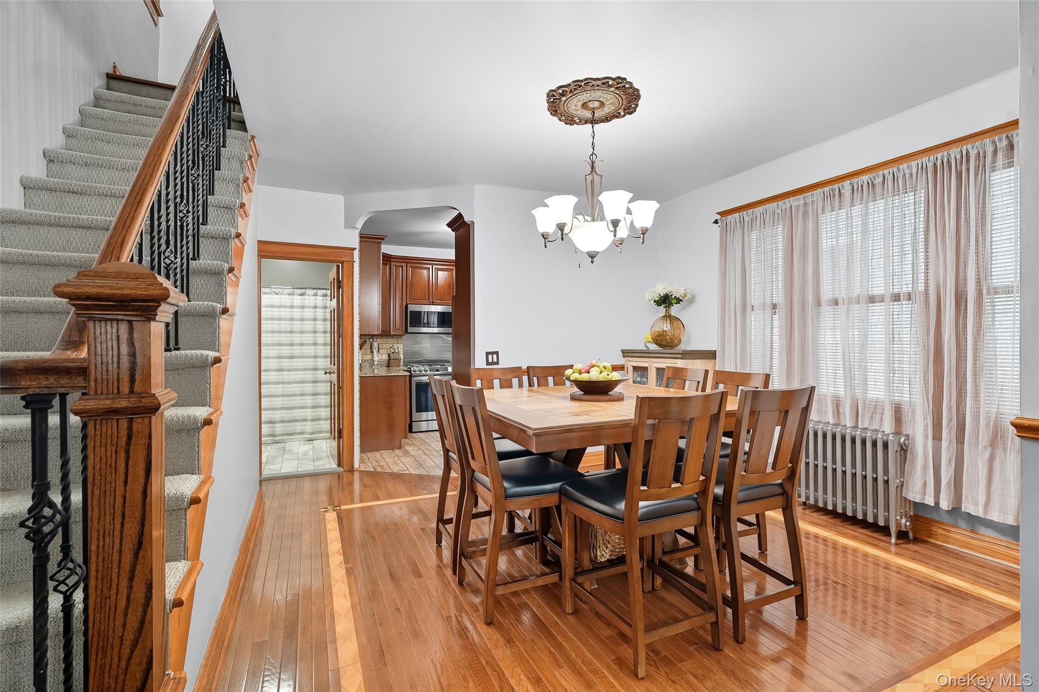 1444 Gillespie Avenue Bronx, NY 10461 - Photo 10 of 49 a view of a dining room with furniture wooden floor and chandelier