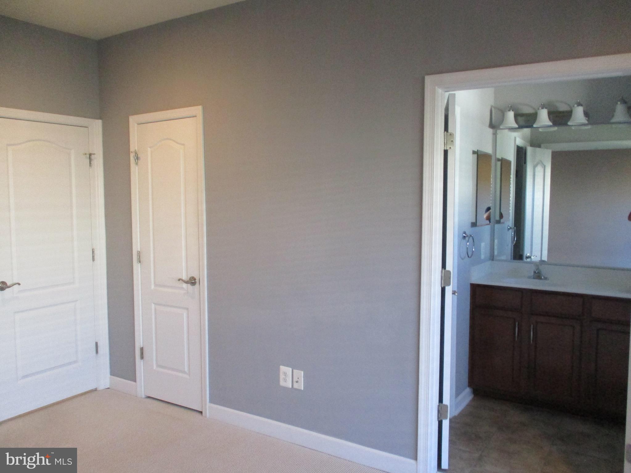 2144 Little Sorrel Way Silver Spring, MD 20902 - Photo 18 of 31 a bathroom with a sink and a mirror
