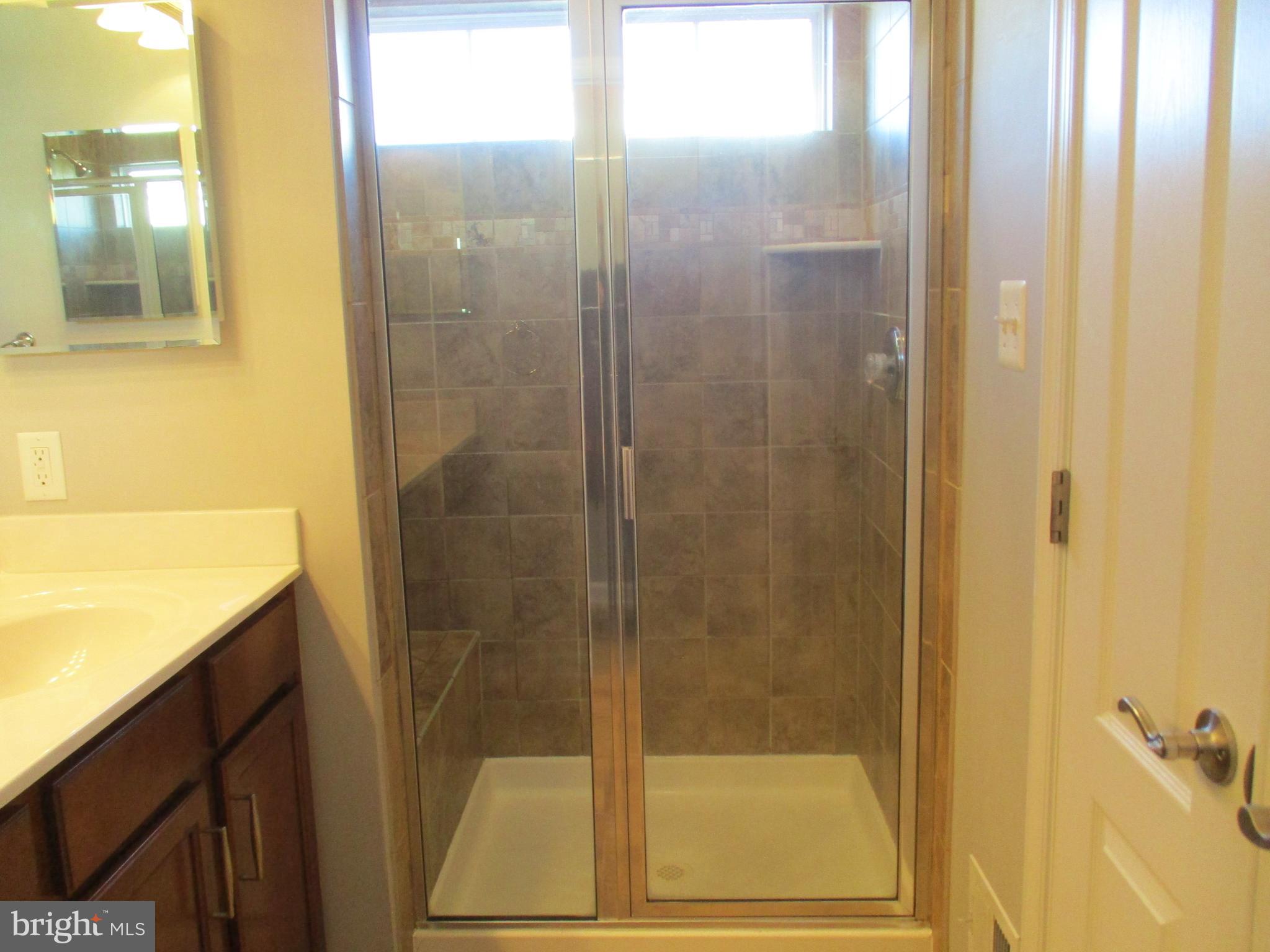 2144 Little Sorrel Way Silver Spring, MD 20902 - Photo 20 of 31 a bathroom with a shower