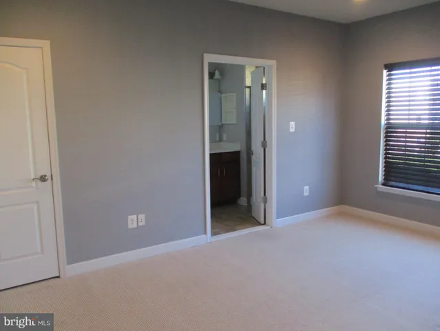 a bathroom with a mirror and a shower