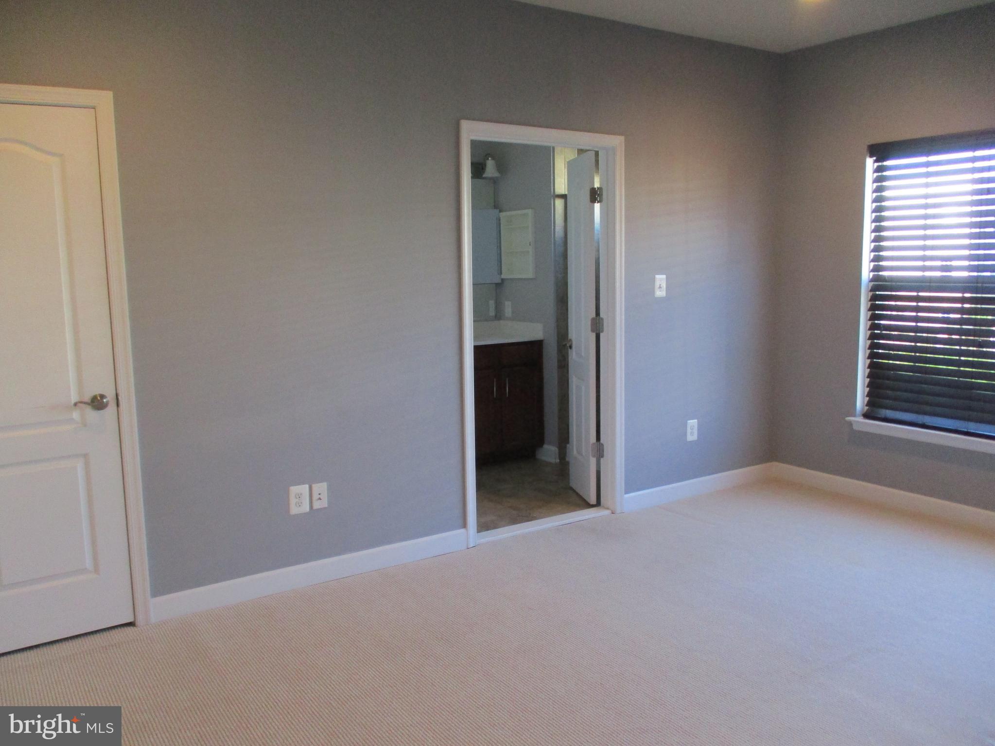 2144 Little Sorrel Way Silver Spring, MD 20902 - Photo 21 of 31 a view of an empty room with a window