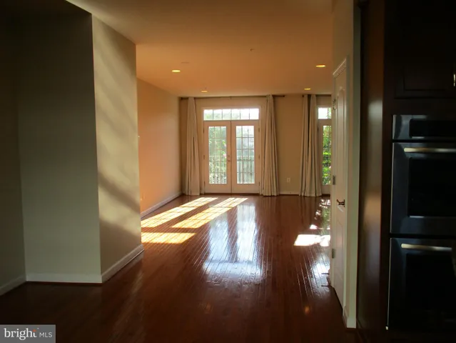 a view of an empty room with windows