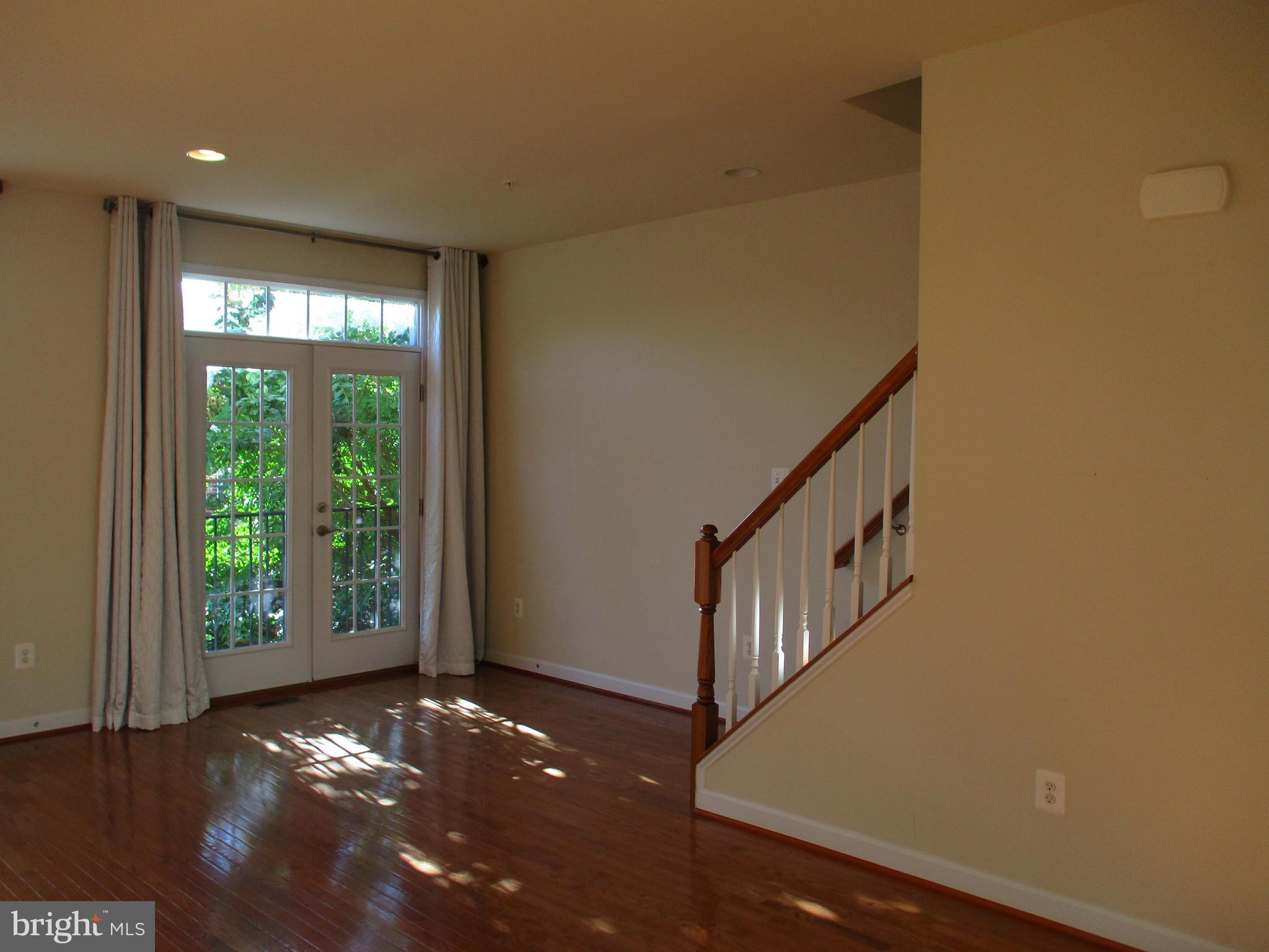 2144 Little Sorrel Way Silver Spring, MD 20902 - Photo 7 of 31 a view of an empty room with windows