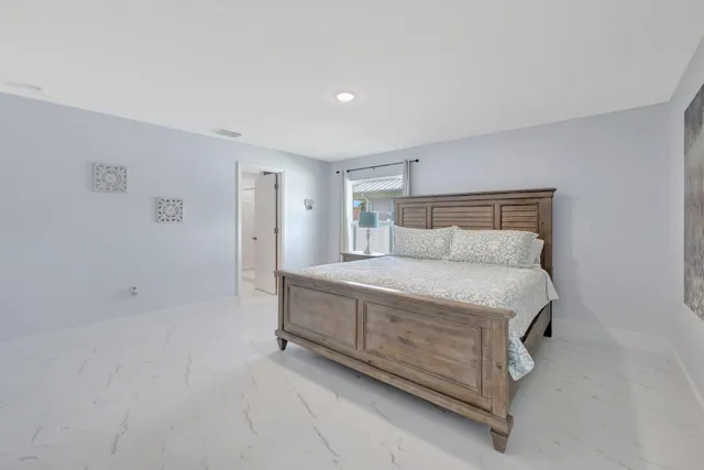 a bedroom with a bed and a cabinets
