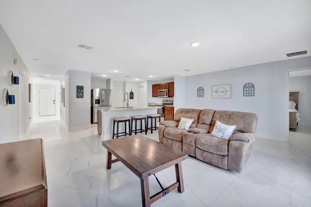 a living room with furniture and a table