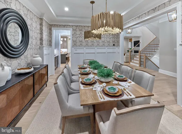 a view of a dining room with furniture and chandelier