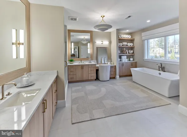 a large white kitchen with a large window