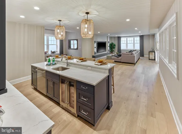 a kitchen with a stove and a wooden floor