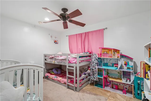 a bedroom with furniture and a baby bed