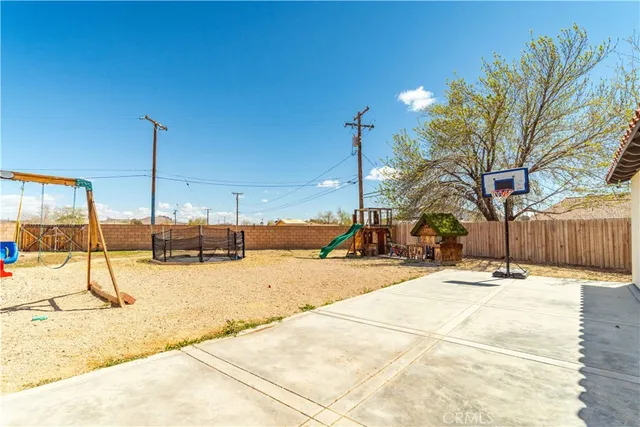 a view of a backyard with a slide