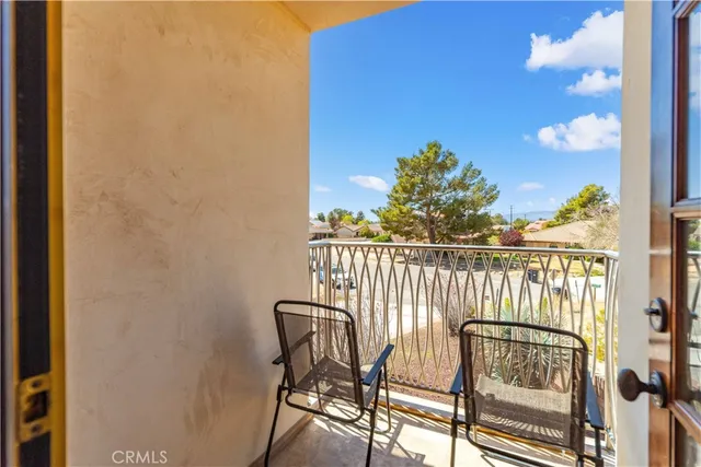 a view of balcony with furniture
