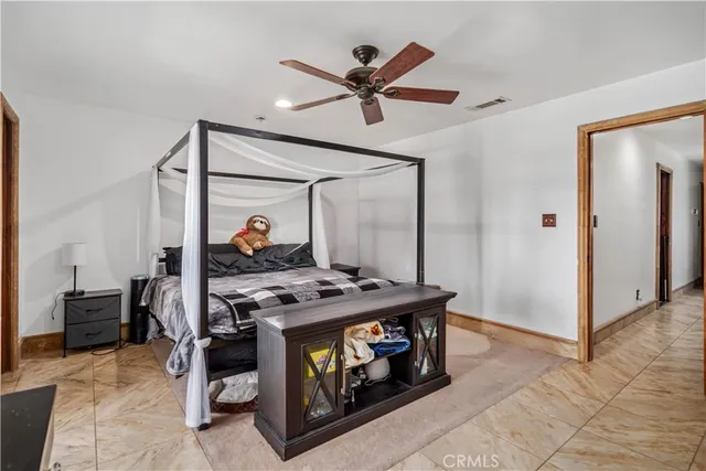 a living room with furniture and a clock