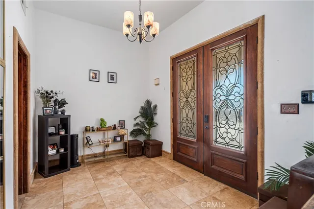 a view of a bedroom with furniture window and front door