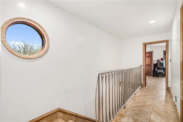 a view of a hallway with small space and wooden floor