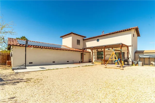 a view of a terrace with wooden fence and a bench