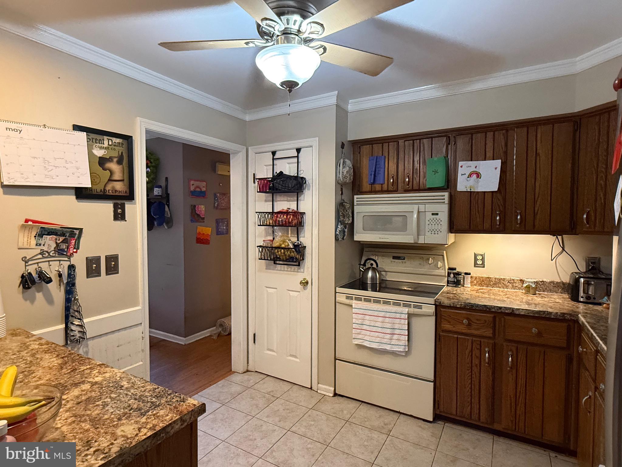 1214 Johnson Road Salisbury, MD 21804 - Photo 23 of 59 a kitchen with a stove sink and cabinets