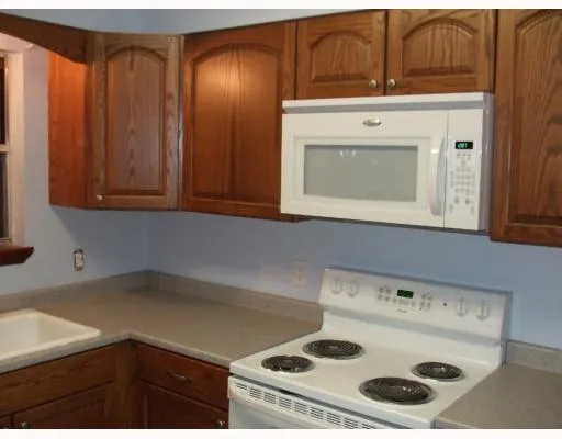 a kitchen with a stove and a microwave