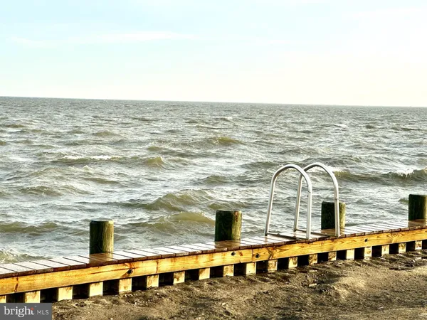 a view of a swimming pool with outdoor seating