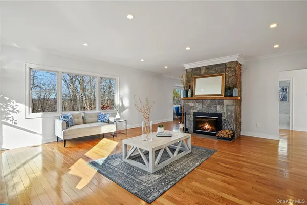 a front view of a house with a yard outdoor seating and yard in the back