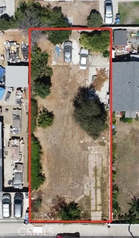 a view of a fence and trees