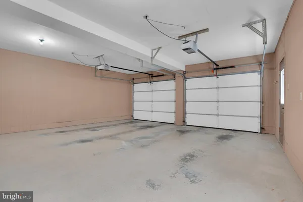 an aerial view of residential houses with outdoor space and swimming pool