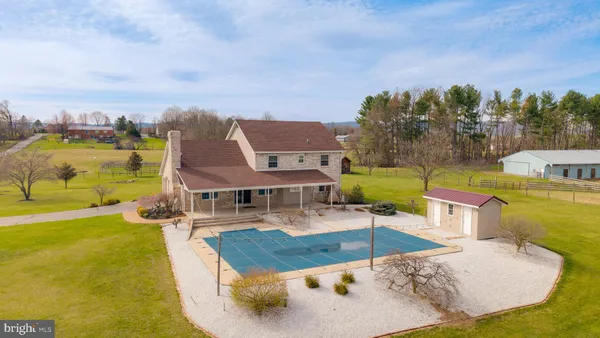 a bathroom with a sink toilet and mirror