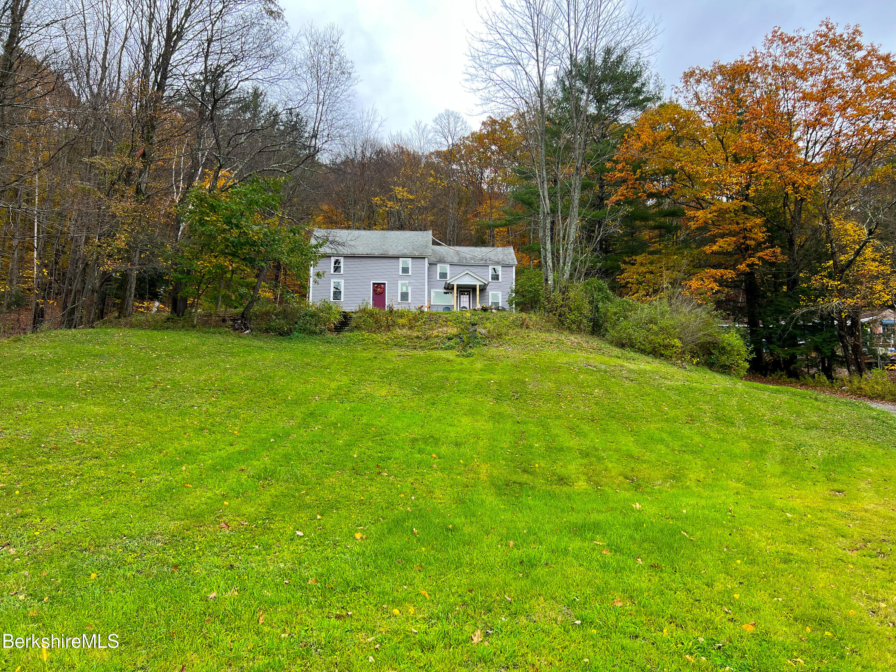 910 Daniels Road Clarksburg, MA 01247 - Photo 2 of 41 a view of a house with a big yard