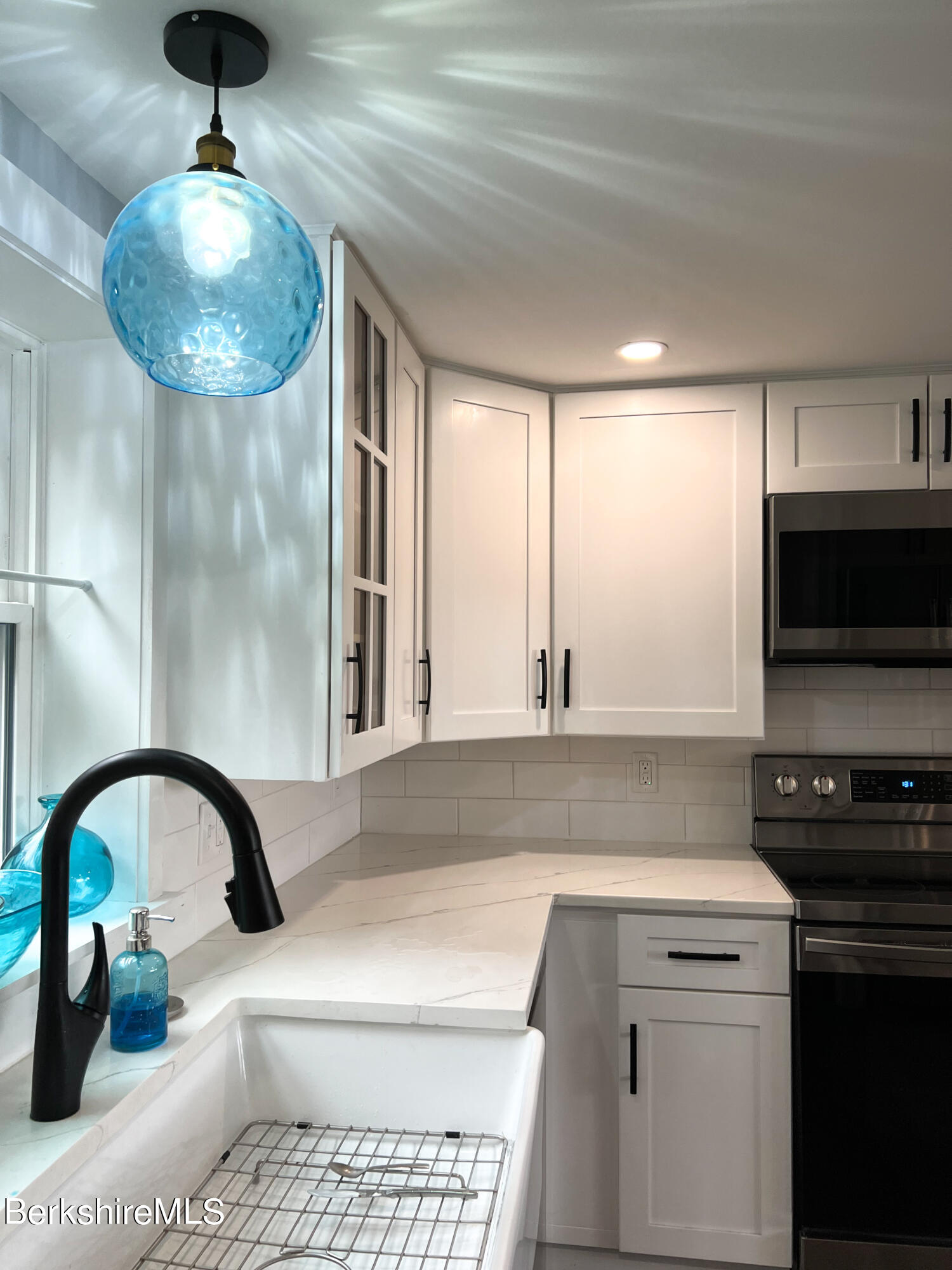 910 Daniels Road Clarksburg, MA 01247 - Photo 11 of 41 a kitchen with a stove and a microwave