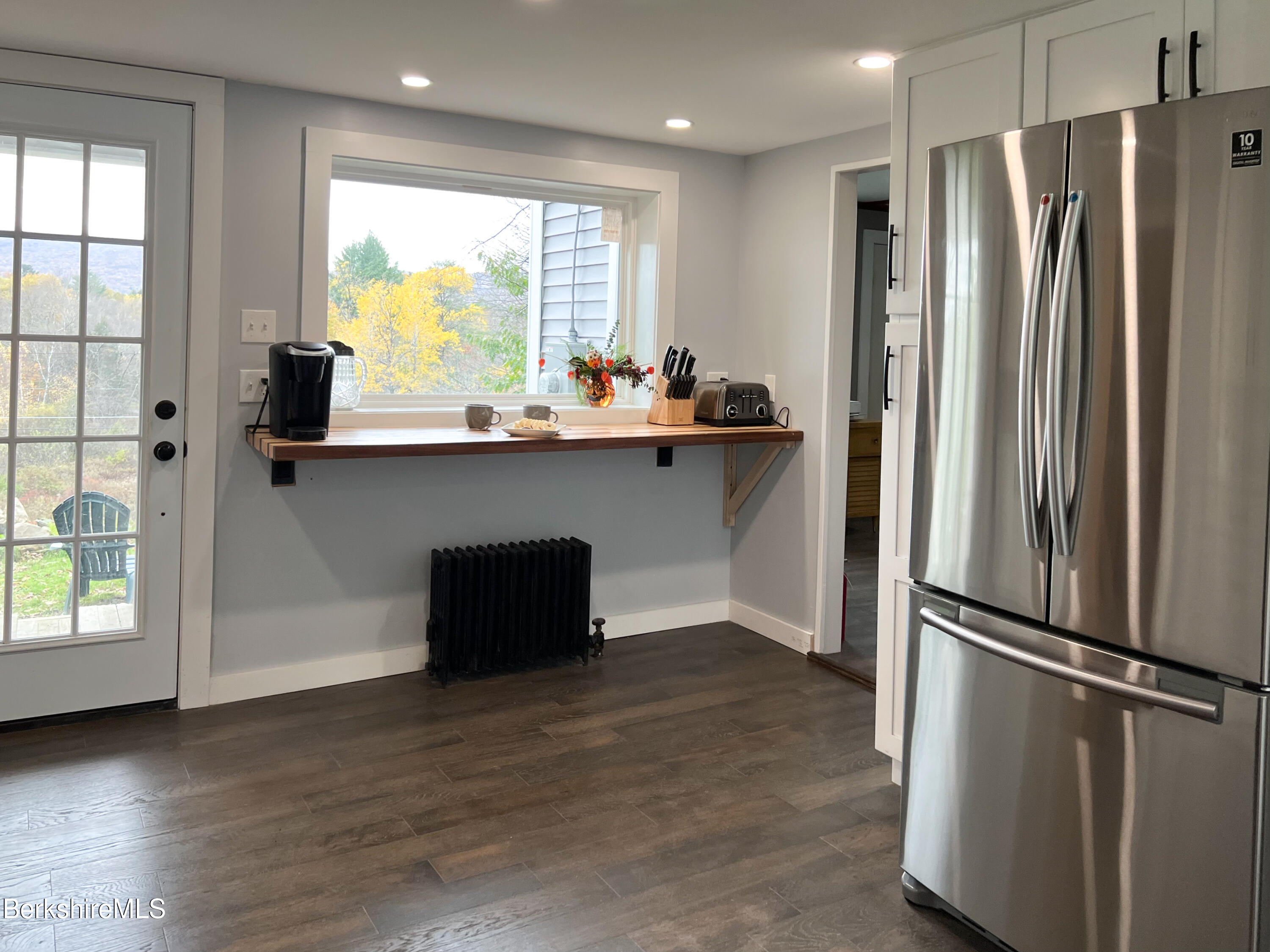 910 Daniels Road Clarksburg, MA 01247 - Photo 14 of 41 a kitchen with stainless steel appliances a refrigerator and a sink
