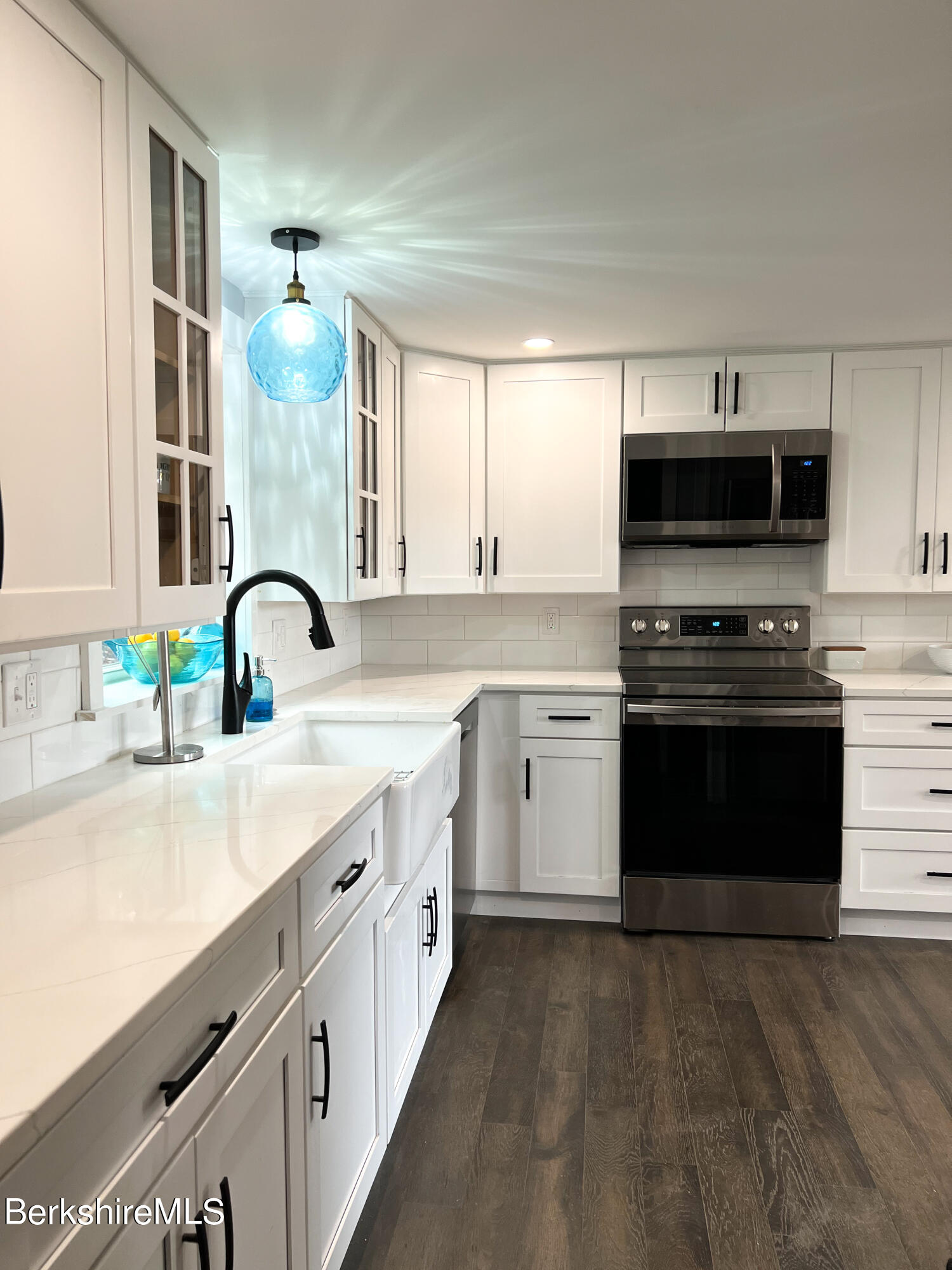 910 Daniels Road Clarksburg, MA 01247 - Photo 18 of 41 a kitchen with a sink stove and microwave